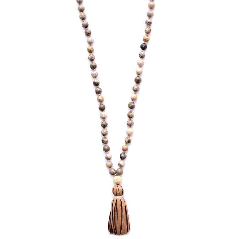 fossil coral & leather tassel