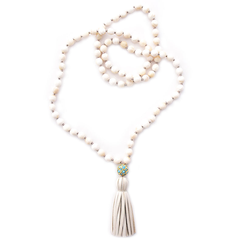shell, turquoise ball & leather tassel
