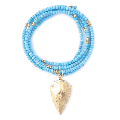 faceted turquoise with gold arrowhead