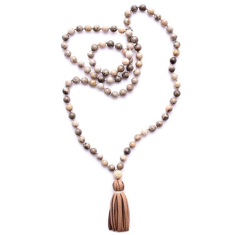 fossil coral & leather tassel