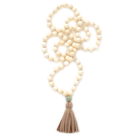 knotted coral with turquoise ball & tassel